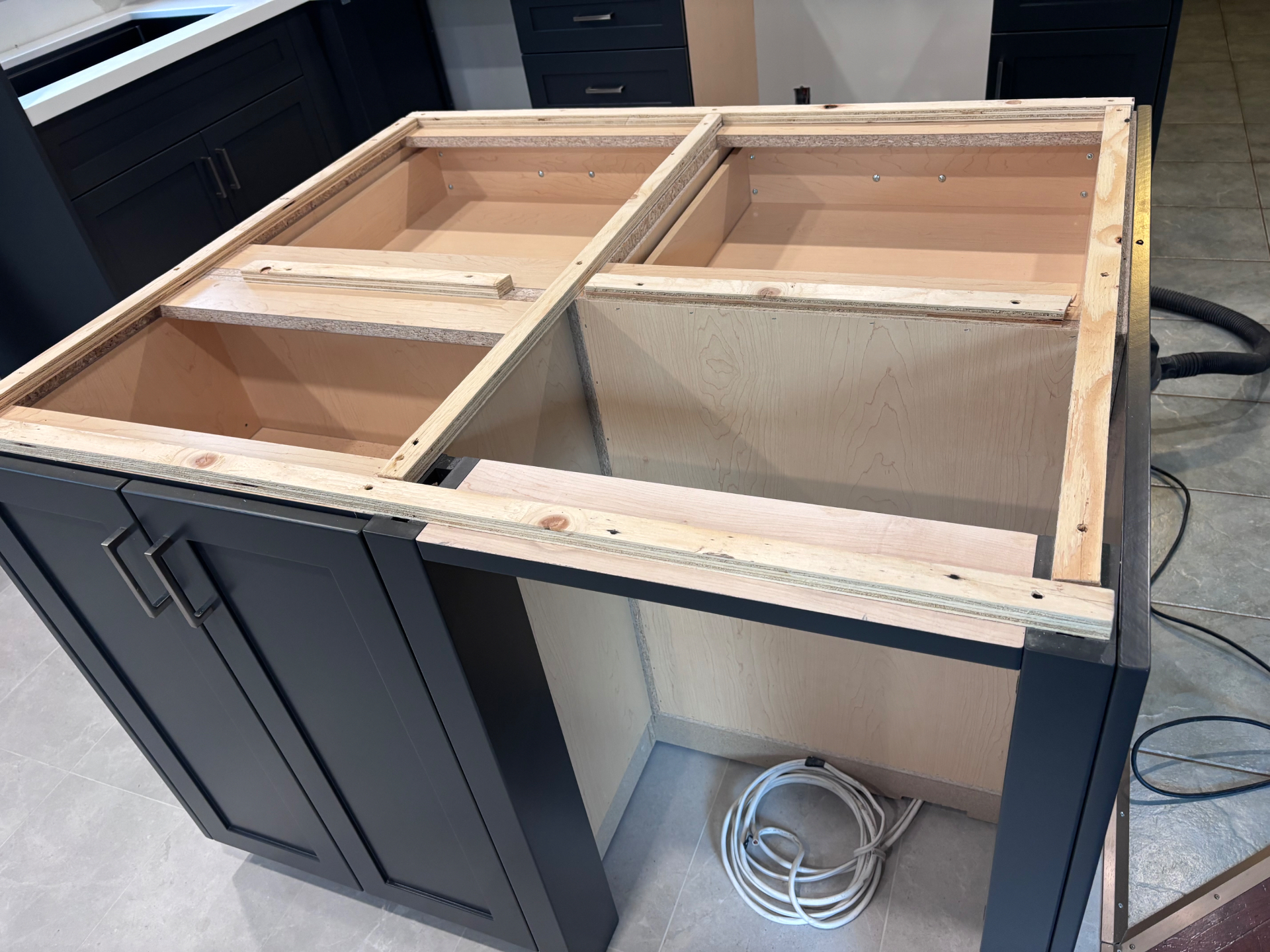 Before: The island and surrounding cabinets were prepared and reinforced for new countertops. in Oakville, Ontario