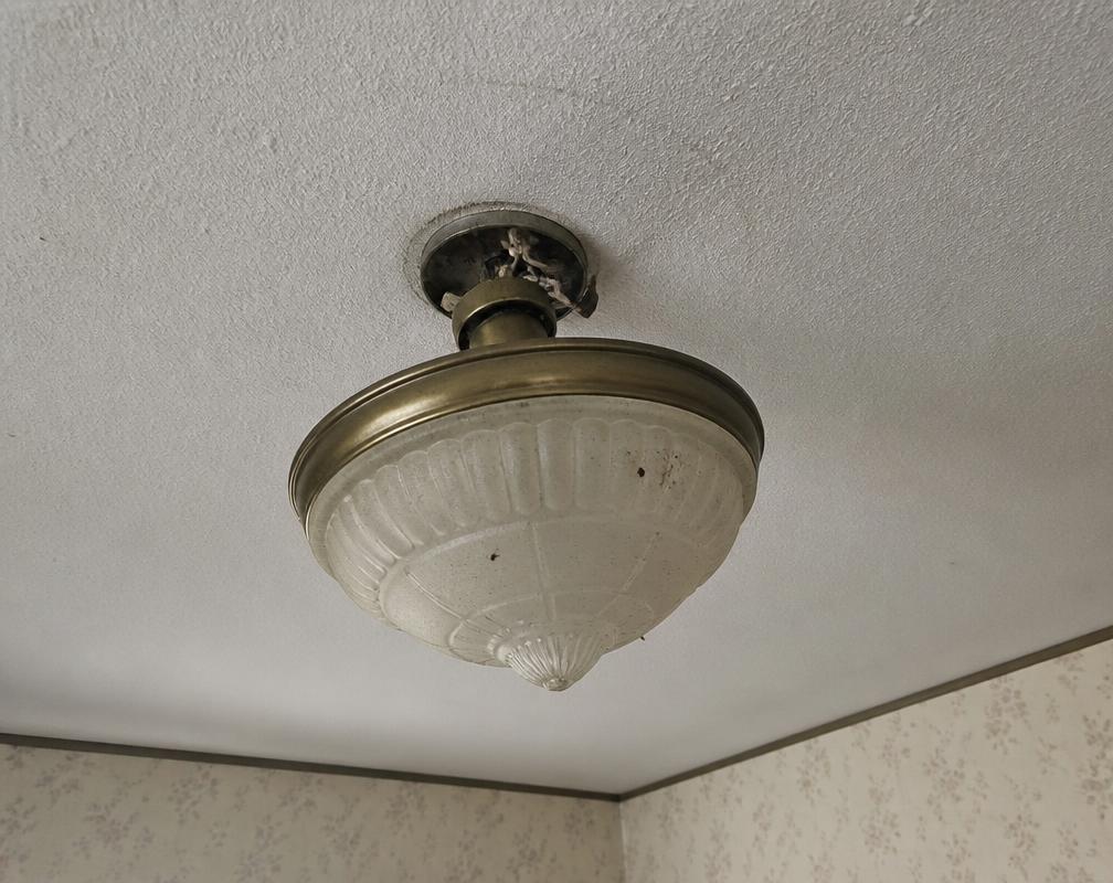 Before: A rattling old light fixture with a loose ceiling box. in Burlington