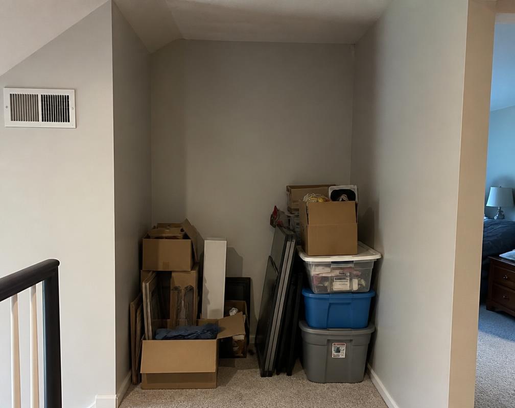 Before: Wasted alcove full of stacked boxes and bins. in Joshua Creek, Oakville